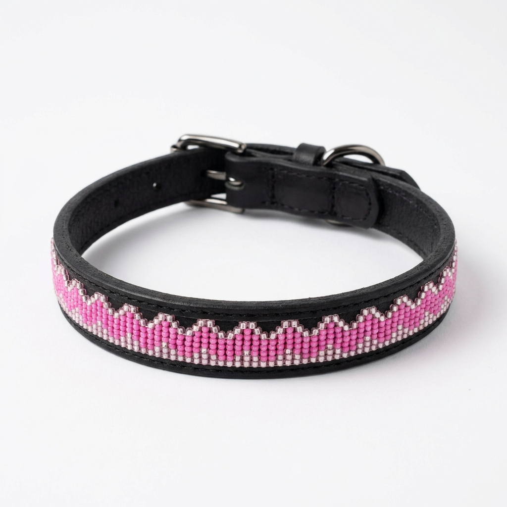 Pink on Black beaded leather dog collar on a white background, bright pink beaded zigzag along a slim black band